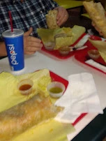 Steak and Chorizo Breakfast Burrito Near and Sausage Breakfast Burrito Far